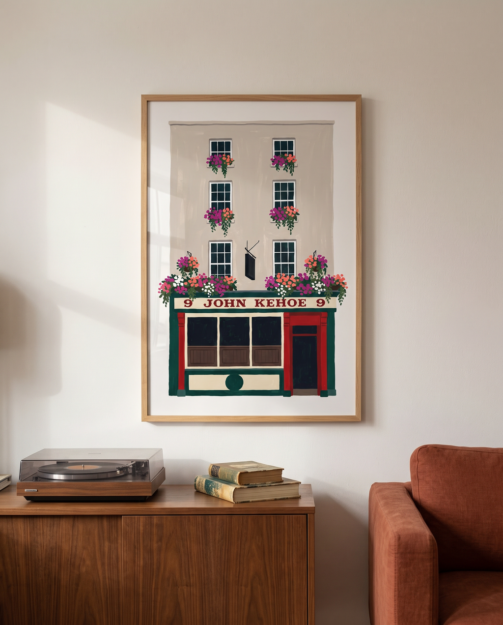 John Kehoe print framed in oak above a walnut sideboard in a city living room